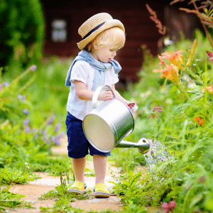 Child watering flowrs